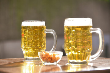 glass of beer on wooden table