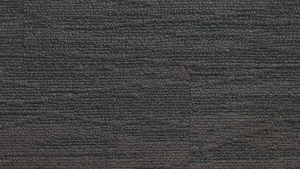 Soft textured fiber dark gray carpet background