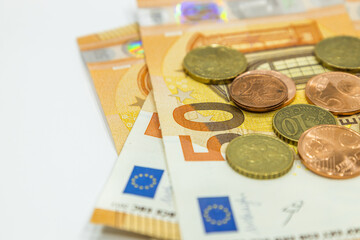 Euro money notes and coins in the background