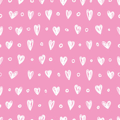 Seamless pattern with small hearts on a pink background.