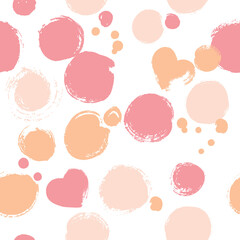 Seamless pattern with polka dots in pink colors. Vector illustration drawn with a dry brush.