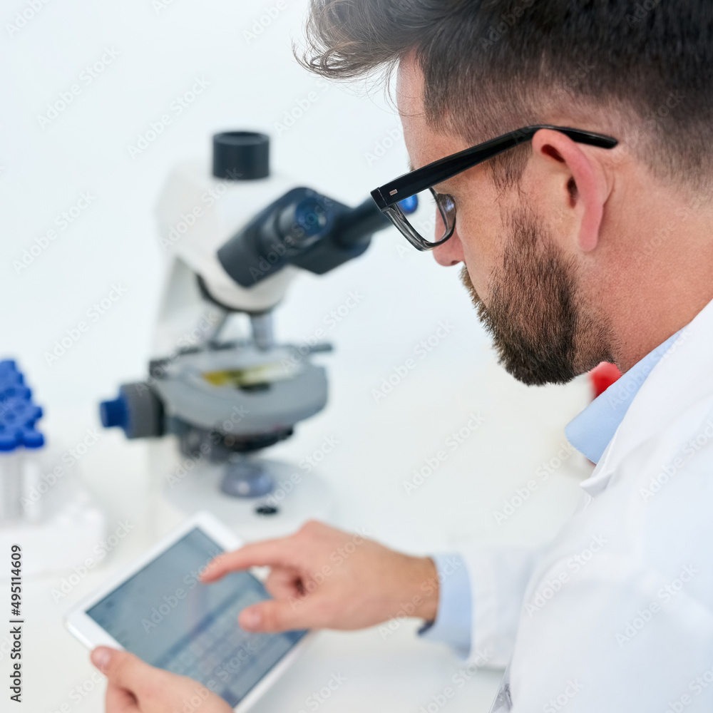 Poster technology helps facilitate cutting-edge medical development. cropped shot of a male scientist worki