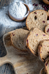 fresh cut bread made of flour and dried cranberries