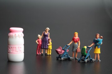 miniature figurines of a mother with her sons and food ingredients