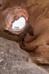 Huge rock cave. A cave where the ancestors lived. Hollow cave. The great cave. Natural window made of stone. eroded cave