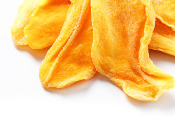 Dried mango sliced on a white background with free space