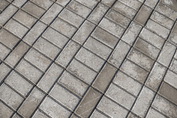 Efflorescence on gray paving slabs. Paving slabs on a construction site as a background