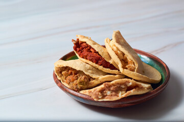 Traditional Mexican gorditas in various flavors. Mexican gastronomy.