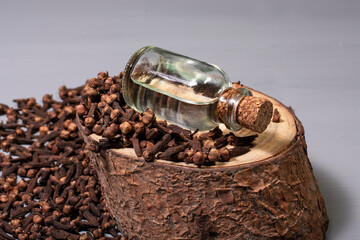 clove grains and a bottle of clove oil. For dieters