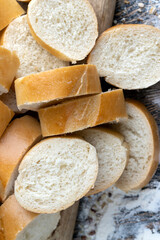 pieces of wheat baguette on a cutting board