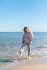 Walk on beach while cold weather