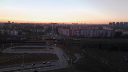 City block. Modern multi-storey buildings. Flying at dusk at sunset. Aerial photography.