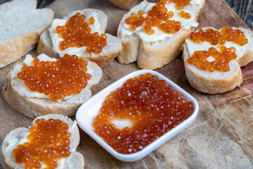 natural red salmon caviar with baguette and butter