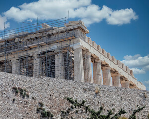 Cloudy sky and partial view of Parthenon ancient temple  on Acropolis hill, Athens, Greece