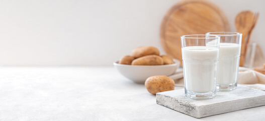 Potato milk on a white background. Lactose-free vegetable milk.