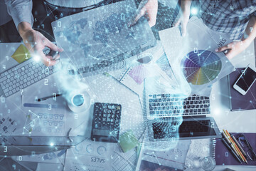 Double exposure of man and woman working together and human brain hologram drawing. Brainstorm concept. Computer background. Top View.