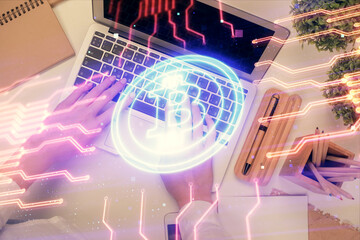 Double exposure of woman hands working on computer and blockchain theme hologram drawing. Top View. bitcoin cryptocurrency concept.