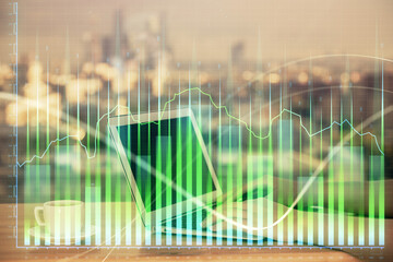 Double exposure of businesswoman hands typing on computer and forex chart hologram drawing....