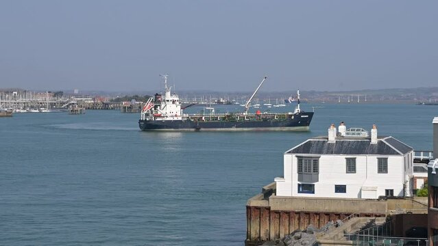 A freighter turning in Portsmouth Harbour a busy commercial and industrial port as well as home to the Royal Navy.