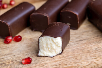 dessert of creamy filling and chocolate on a board