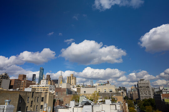 Clouds float over the East Village buildings and Midtown Manhattan skyscraper on October 22, 2021 in New York City NY USA.