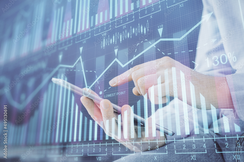 Poster double exposure of man's hands holding and using a digital device and forex graph drawing. financial