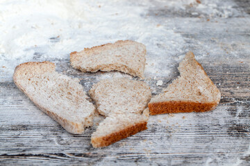 wheat flour bread and wheat flour on a board