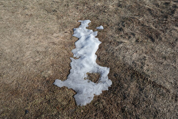 Melting snow. End of winter and wintertime, beginning of spring and springtime. Simple minimalist...