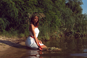 Fototapeta premium Young woman on the banks of the Dnieper river