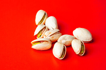 very tasty pistachio nuts on the red