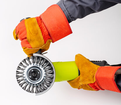 Angle grinder in hands  on white background