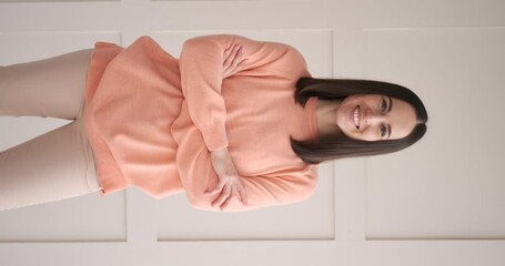 Vertical video of beautiful young woman smiling - Powered by Adobe