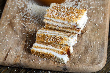 creamy cream and caramel cakes sprinkled with sesame
