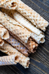thin crispy waffles lie on a black table