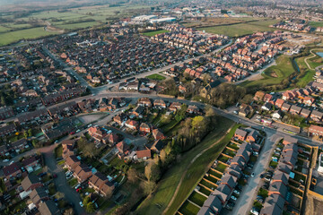 Fototapeta na wymiar Aerial View Houses Residential British England Drone Above View Summer Blue Sky Estate Agent.