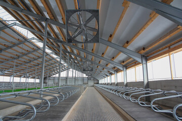 Fototapeta premium The final stage of construction of the agricultural complex. Construction of a new large hangar. Construction of the new barn.