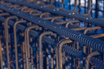 The rebar is bonded with steel wire. Close up of iron rods used for construction.