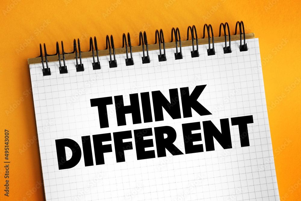 Poster think different text on notepad, concept background