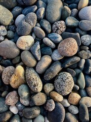 Close up of grey stones of different size. Background. Top view.