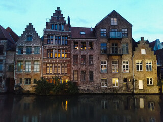 Fototapeta na wymiar The medieval architecture of Ghent in Belgium illuminated in the evening