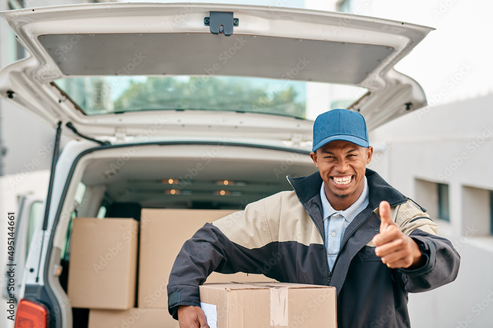 Aufkleber its been a good day of deliveries. portrait of a courier showing thumbs up while unloading boxes fro