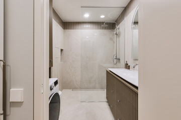 Fototapeta na wymiar Modern minimalist bathroom interior design with marble stone tiles and khaki furniture