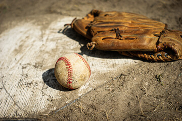Ol baseball glove on home plate