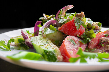 Summer vegetable salad of cucumbers, tomatoes and onions