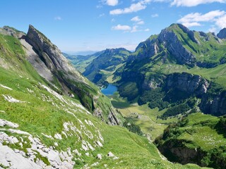 Fototapeta na wymiar Panoramic view of idyllic Seealpsee in Alpstein massif. Appenzell, Switzerland.