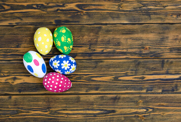 Easter eggs on wooden background with copy space