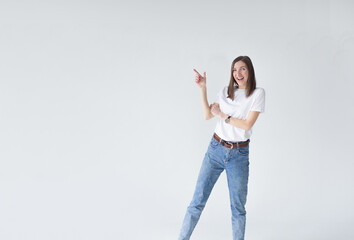 A young girl points and looks to the left at the logo with a happy smile, showing an advertisement standing on a white background.