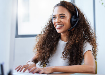 Hello how may I help you today. Shot of a young businesswoman working in a call center.