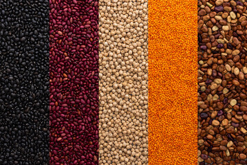 Different types of legumes, chickpeas and lentils, red, black and brown beans , top view