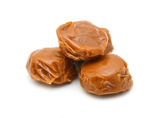 Caramel candies isolated on white background